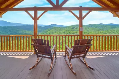 two chairs on the deck of a Smoky Mountain cabin