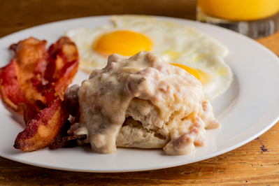 biscuits and gravy breakfast with eggs and bacon